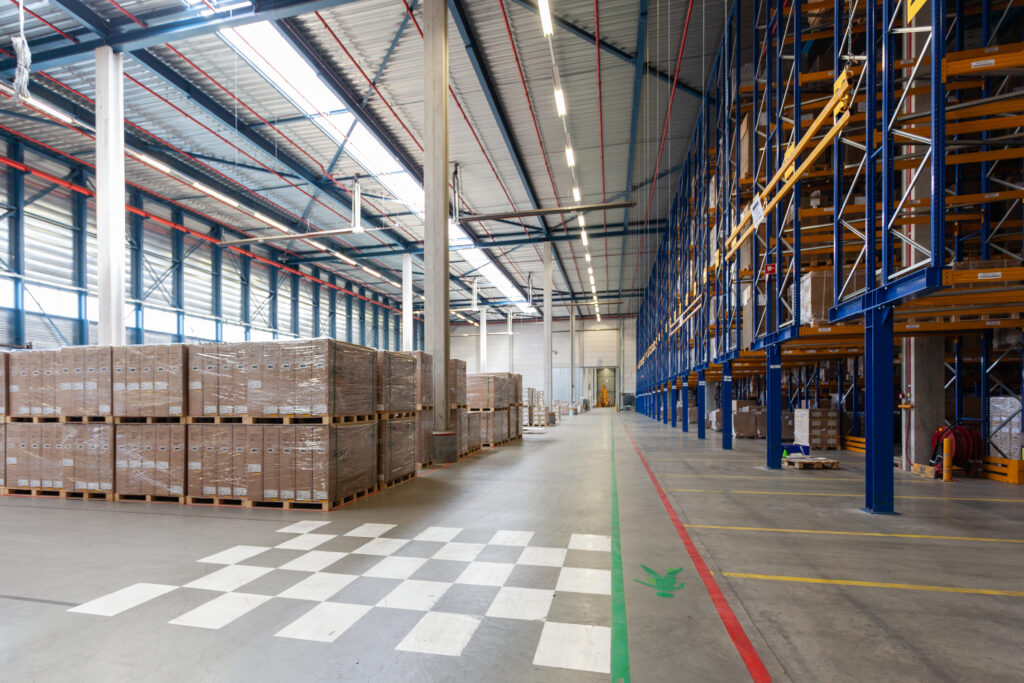 View of full warehouse with forklift. Custom clearance agent in Dubai