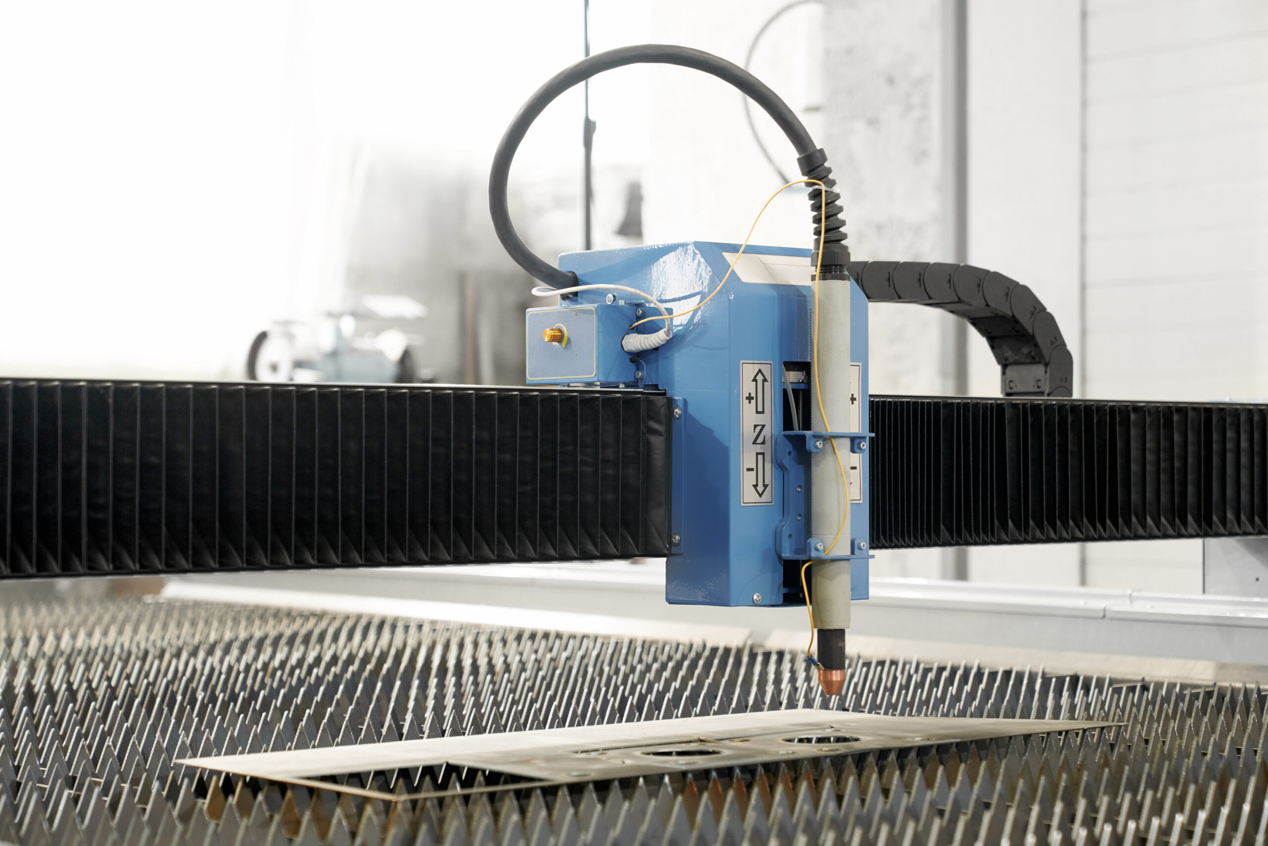 Professional modern plasma cutter on metal factory. Custom clearance agent in dubai.